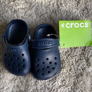 New with tags! Baby crocs size c4 in navy blue.